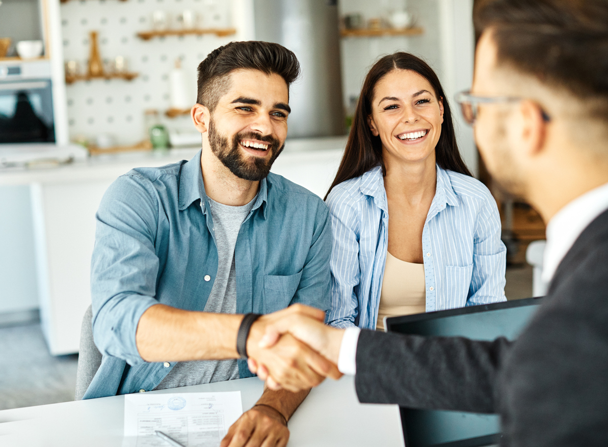Advisor meeting with a client at home to review a financial plan